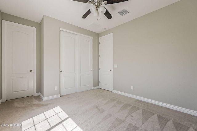 3310 E Los Gatos Dr, Phoenix, AZ 85050 - unfurnished bedroom featuring light carpet, a closet, baseboards, and a ceiling fan