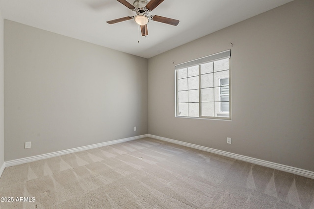 3310 E Los Gatos Dr, Phoenix, AZ 85050 - spare room featuring light carpet, a ceiling fan, and baseboards