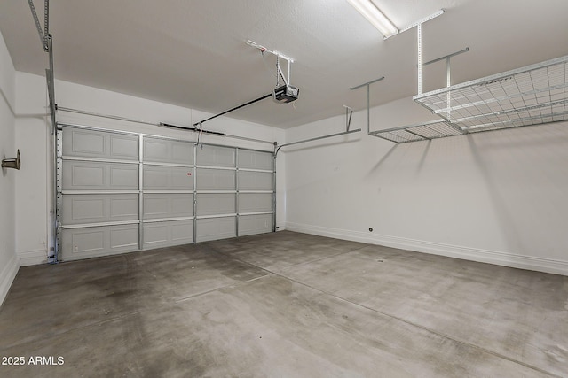 3310 E Los Gatos Dr, Phoenix, AZ 85050 - garage with a garage door opener and baseboards