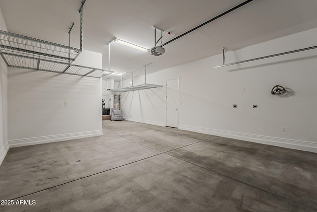 3310 E Los Gatos Dr, Phoenix, AZ 85050 - garage with baseboards and a garage door opener