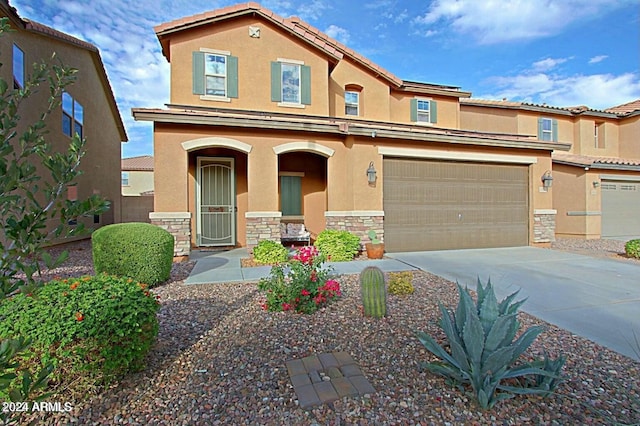 view of front of property featuring a garage