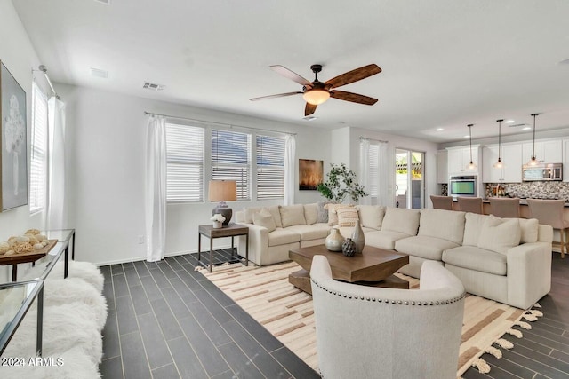 living room featuring ceiling fan