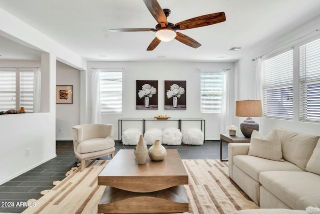 living room with hardwood / wood-style flooring and ceiling fan