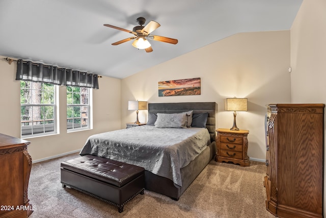 bedroom with carpet flooring, vaulted ceiling, and ceiling fan