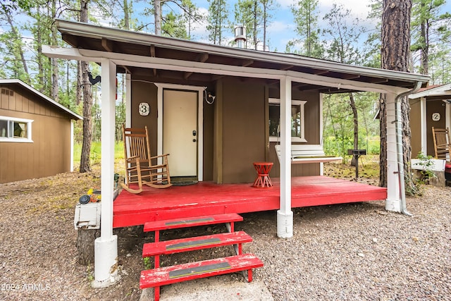 exterior space featuring a wooden deck