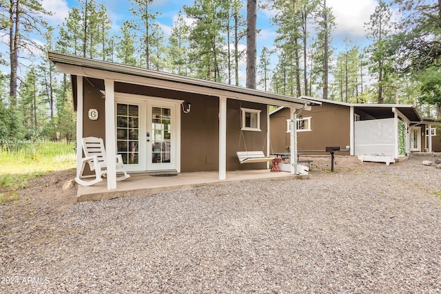 view of front facade featuring french doors and a patio