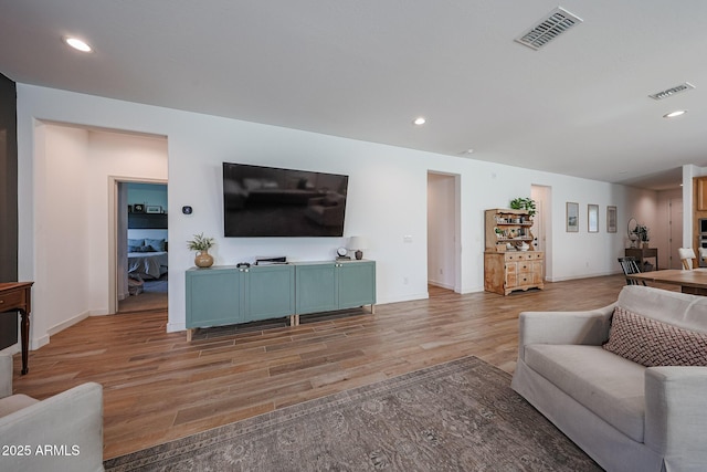 10964 W Garfield St, Avondale, AZ 85323 - living room with light wood-style floors and recessed lighting