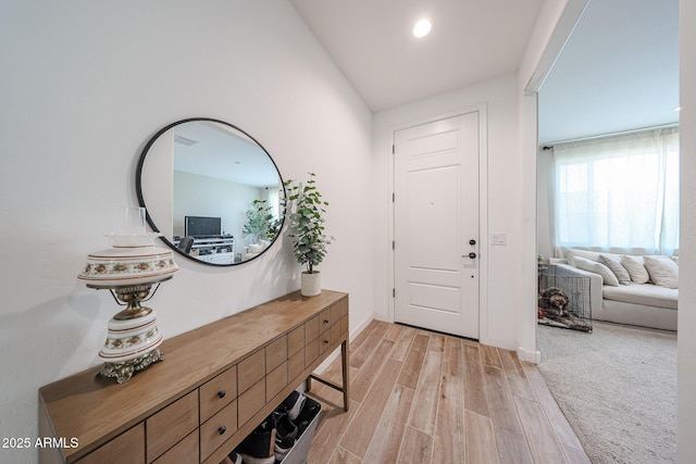 10964 W Garfield St, Avondale, AZ 85323 - entryway featuring light wood-type flooring and vaulted ceiling