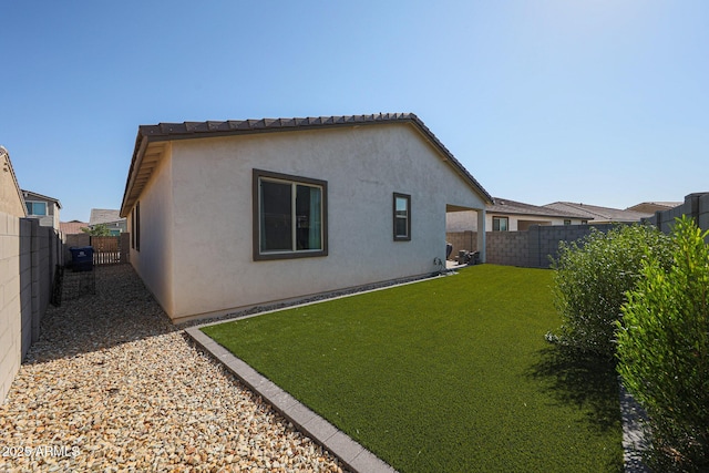 10964 W Garfield St, Avondale, AZ 85323 - back of house with stucco siding and a fenced backyard
