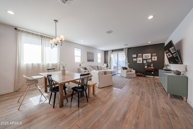 10964 W Garfield St, Avondale, AZ 85323 - dining space with light wood finished floors, a chandelier, and recessed lighting