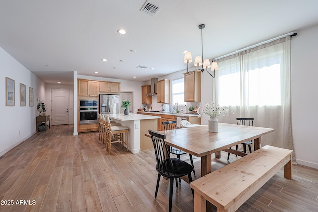 10964 W Garfield St, Avondale, AZ 85323 - dining area with light wood finished floors and recessed lighting