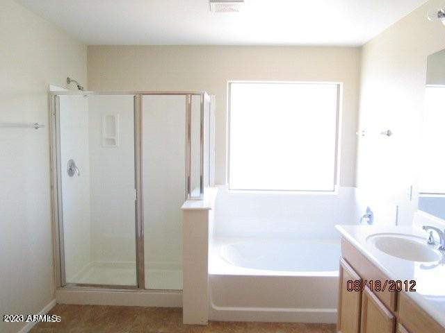 9018 W Superior Ave, Tolleson, AZ 85353 - full bath with a stall shower, vanity, and a bath