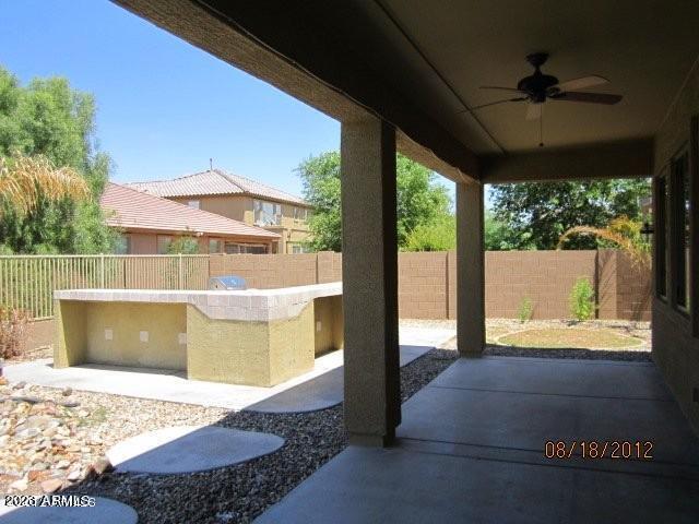 9018 W Superior Ave, Tolleson, AZ 85353 - fenced backyard with ceiling fan and a patio