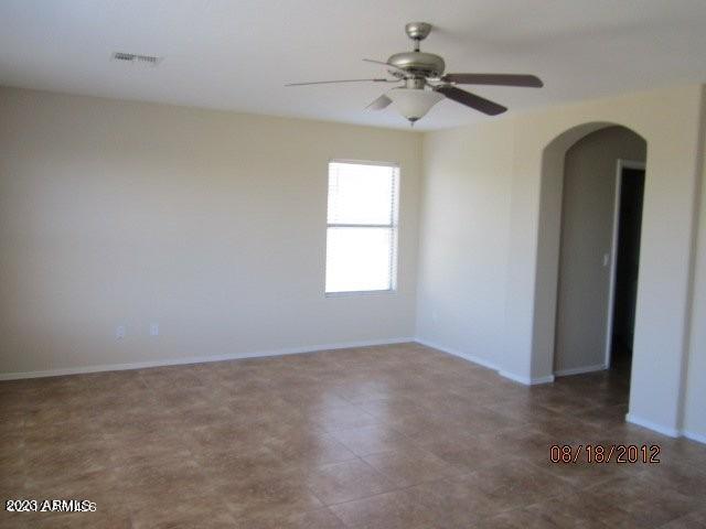 9018 W Superior Ave, Tolleson, AZ 85353 - unfurnished room featuring a ceiling fan and arched walkways