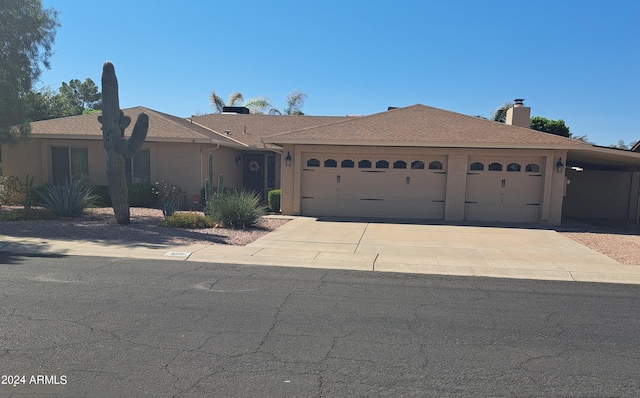 single story home with a garage