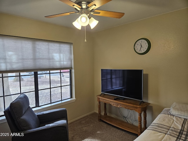 living room featuring ceiling fan and carpet