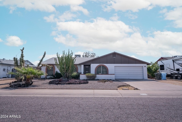 ranch-style home with a garage