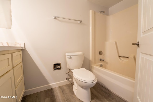 full bathroom with vanity, hardwood / wood-style flooring, tub / shower combination, and toilet