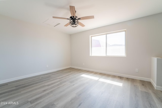 unfurnished room with light hardwood / wood-style flooring and ceiling fan