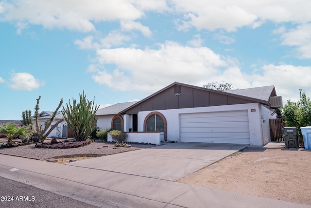 ranch-style house featuring a garage