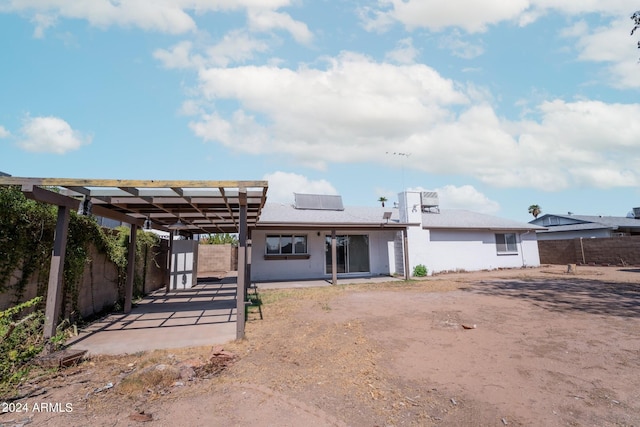 rear view of house with a patio