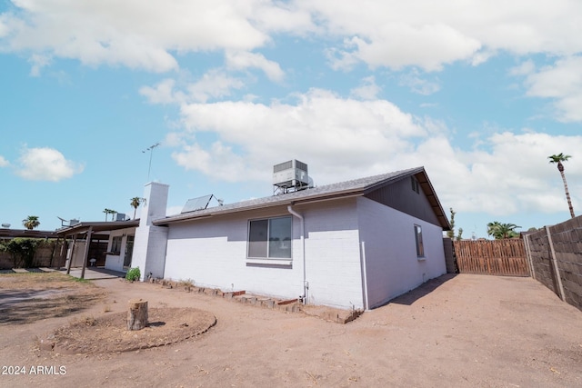 back of property with central AC unit