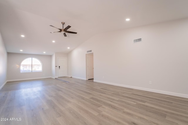 spare room with ceiling fan, light hardwood / wood-style flooring, and lofted ceiling