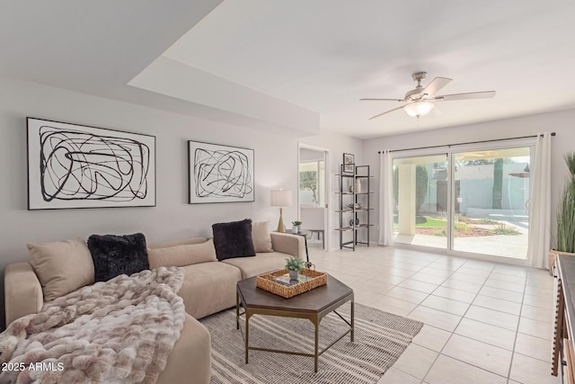 tiled living room with ceiling fan