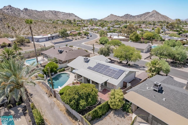 birds eye view of property with a mountain view