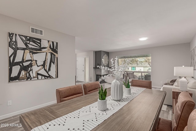 dining room with wood-type flooring