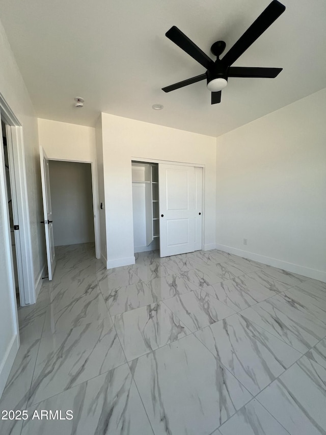 3755 N 363rd Ave, Tonopah, AZ 85354 - unfurnished bedroom featuring baseboards, marble finish floors, a closet, and a ceiling fan