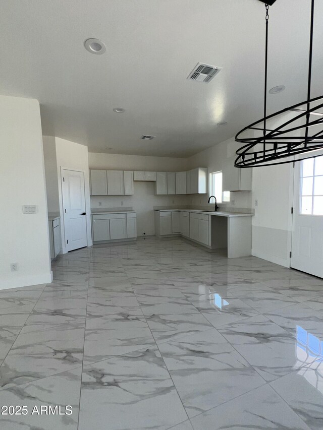 3755 N 363rd Ave, Tonopah, AZ 85354 - kitchen with baseboards, light marble finish floors, a sink, and recessed lighting