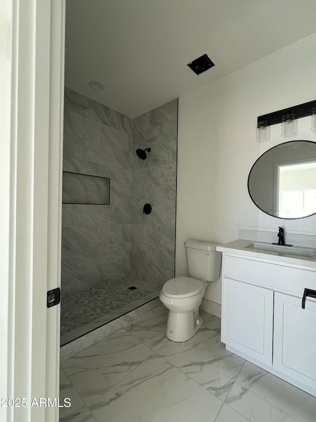 3755 N 363rd Ave, Tonopah, AZ 85354 - bathroom featuring marble look tile flooring, vanity, toilet, and tiled shower