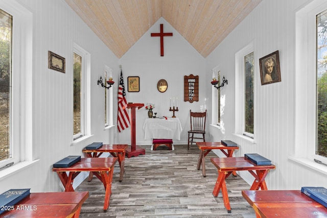 sunroom featuring wooden ceiling and vaulted ceiling