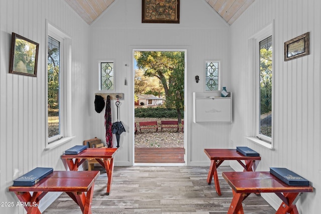 entryway with a wealth of natural light, lofted ceiling, and wood ceiling