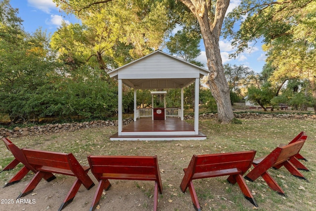 surrounding community with a gazebo and a lawn