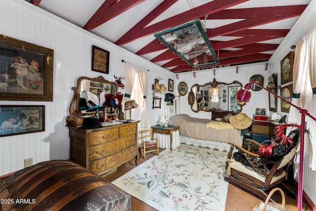 bedroom with vaulted ceiling with beams