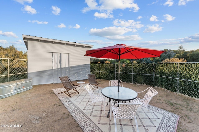 view of patio / terrace with an outdoor structure