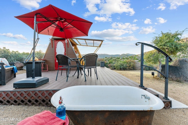 wooden terrace with a mountain view