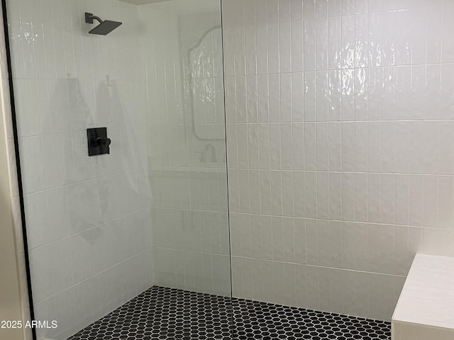 bathroom with a tile shower