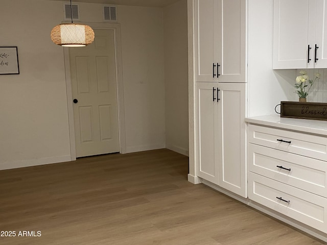 hallway with light wood-type flooring