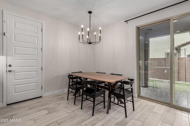 dining area with a notable chandelier