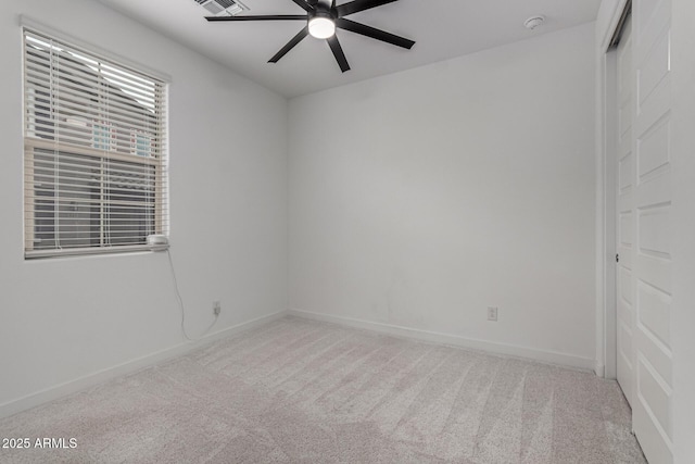 carpeted empty room with ceiling fan