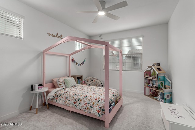 bedroom featuring light carpet and ceiling fan