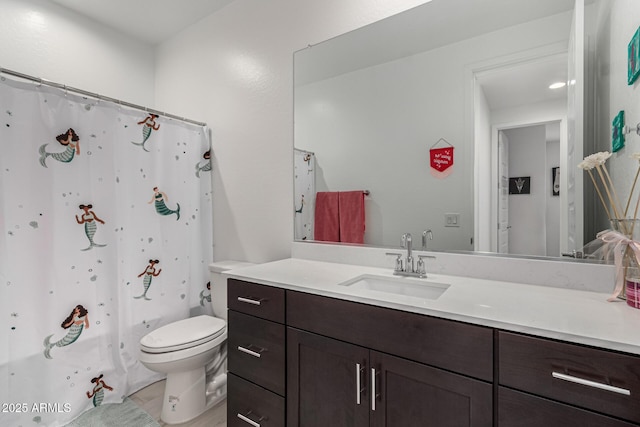 bathroom with tile patterned floors, vanity, a shower with shower curtain, and toilet