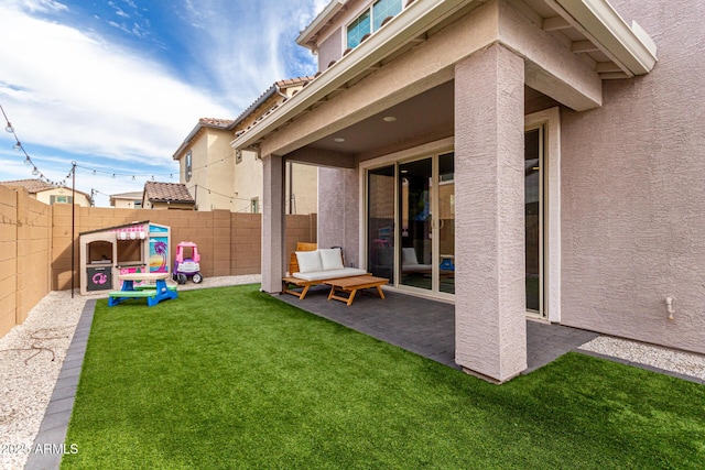 exterior space featuring a lawn and a patio area