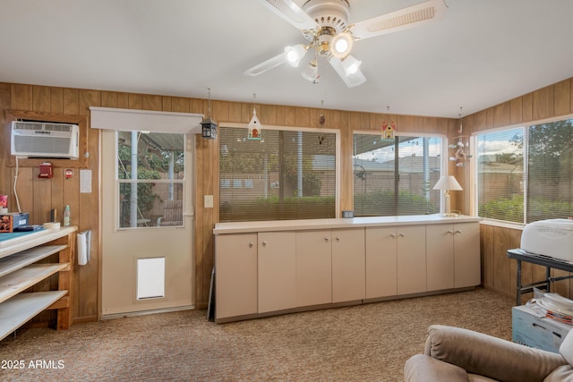 interior space with an AC wall unit and ceiling fan