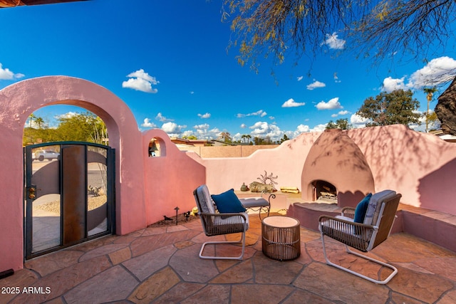 2843 E Captain Dreyfus Ave, Phoenix, AZ 85032 - view of patio / terrace featuring an outdoor fireplace