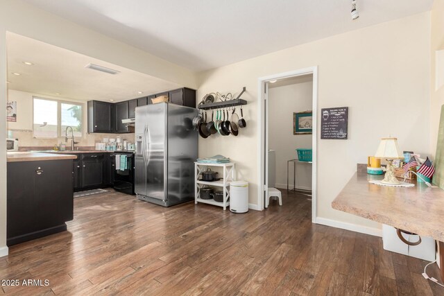 2843 E Captain Dreyfus Ave, Phoenix, AZ 85032 - kitchen featuring stainless steel fridge with ice dispenser, dark cabinets, dark wood-style flooring, black electric range, and recessed lighting