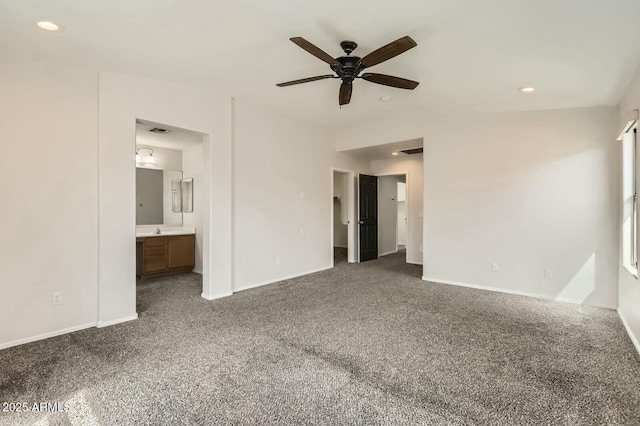 unfurnished bedroom featuring carpet floors, lofted ceiling, recessed lighting, visible vents, and ensuite bath